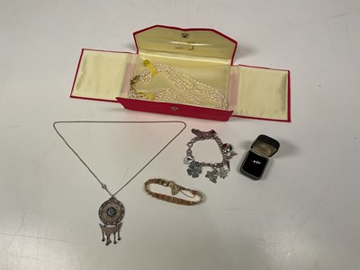 Lot 1191 - A 9ct gold chain link bracelet, also with a...