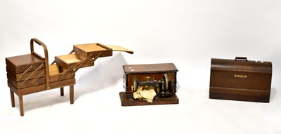 Lot 111 - An oak cased Singer sewing machine, one other...