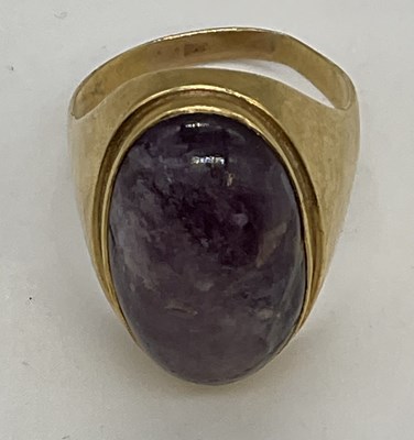 Lot 1174 - A substantial yellow metal purple agate oval...