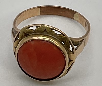 Lot 1238 - A yellow metal and coral cabochon set...