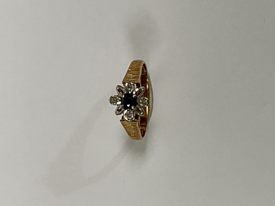 Lot 1230 - An 18ct yellow gold sapphire and diamond chip...