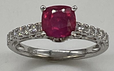 Lot 1145 - An 18ct white gold ruby and diamond ring, the...