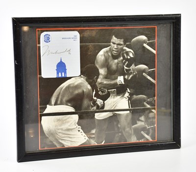Lot 1375 - MUHAMMAD ALI; a black and white photograph of...