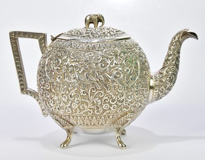 Lot 2100 - A late 19th century Indian silver kutch teapot...