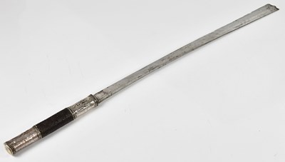Lot 699 - An Indian Naga sword with white metal handle...