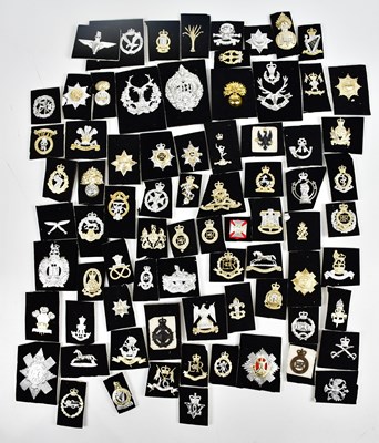 Lot 426 - A large collection of Staybrite cap badges,...