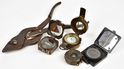 Lot 431 - Four military compasses, with a set of cast...