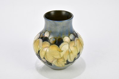 Lot 70 - WALTER MOORCROFT; two salt glazed vases...