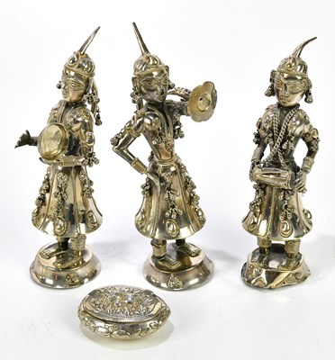 Lot 2337 - Three Eastern white metal figures of musicians,...