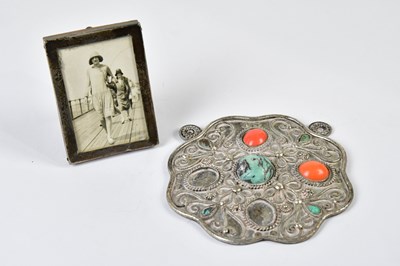 Lot 2621 - An Eastern white metal plaque, relief...
