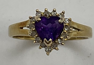 Lot 1194 - A 14ct yellow gold amethyst and diamond heart...