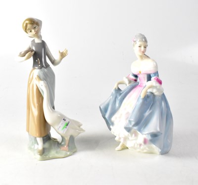 Lot 178 - A Lladró figure of a young goose girl on stylised plinth