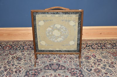 Lot 5334 - An early 20th century fire screen with silk...