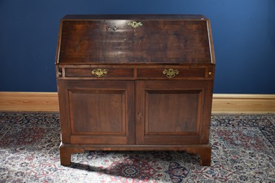 Lot 6523 - A Georgian oak bureau, the fall front with...
