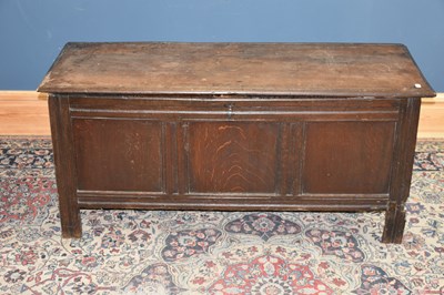 Lot 6524 - An 18th century oak coffer with panelled front,...