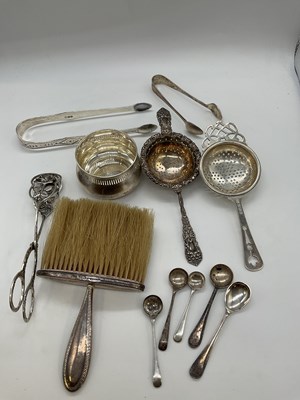 Lot 1064 - A group of small silver including a tea...