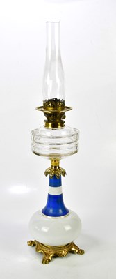 Lot 1599 - A Victorian milk glass oil lamp with gilt...
