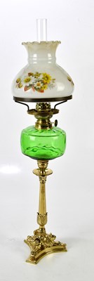 Lot 1615 - A green glass vessel oil lamp on brass shaped...