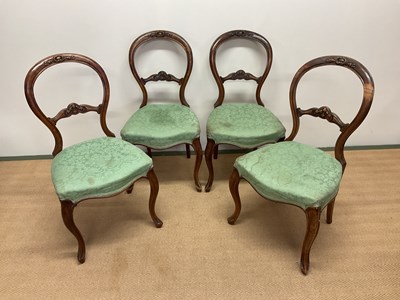 Lot 486 - A set of four Victorian walnut carved balloon...