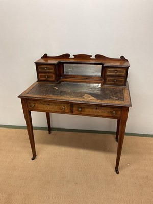 Lot 415 - An Edwardian rosewood writing table with four...
