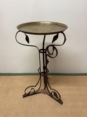 Lot 364 - A wrought iron scrolling frame set with a...