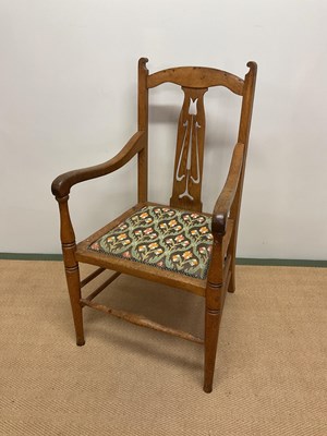 Lot 481 - An Arts and Crafts oak open elbow chair with...