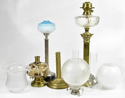 Lot 1177 - A Victorian brass oil lamp. With milk glass...