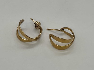 Lot 1280 - A pair of 9ct pierced yellow gold half hoop...