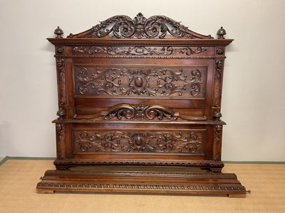 Lot 531 - A French walnut carved double bed, width 64...