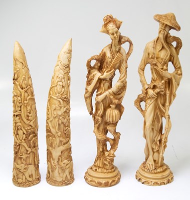 Lot 1030 - A pair of decorative resin tusks, height 41cm,...