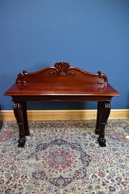 Lot 2443 - A Victorian mahogany hall table with scroll...