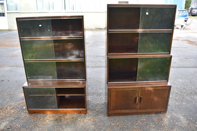 Lot 2609 - MINTY; a pair of bookcases with sliding doors.