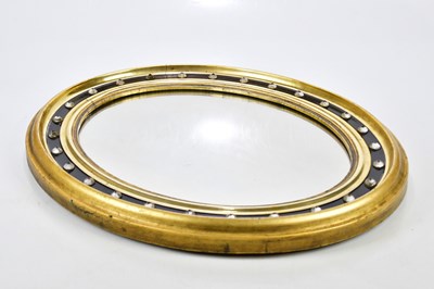 Lot 2420 - An early 19th century Irish oval wall mirror...