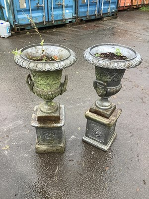 Lot 2261 - A pair of early 20th century cast iron urns on...