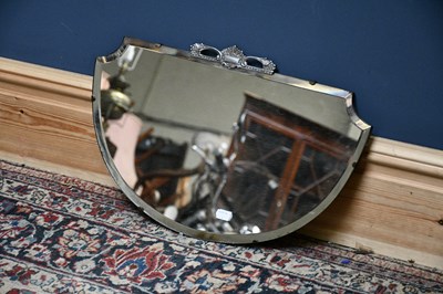 Lot 2548 - An Art Deco chrome mounted shaped wall mirror...