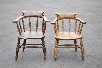 Lot 2460 - Two 19th century elm seated elbow chairs on...