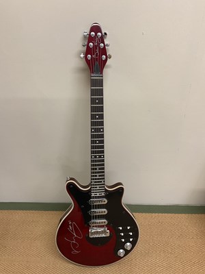 Lot 526 - SIR BRIAN MAY; a 'Special Red' signed guitar.