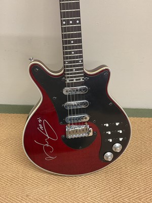 Lot 526 - SIR BRIAN MAY; a 'Special Red' signed guitar.