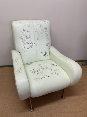 Lot 2269 - Rock & Pop; a white faux leather chair signed...