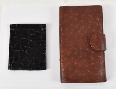 Lot 504 - A burgundy red ostrich skin wallet with six...