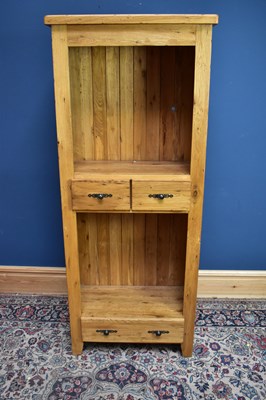 Lot 2637 - A modern hardwood bookcase with an arrangement...