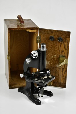 Lot 1563 - BECK, LONDON; a lacquered microscope in oak case.