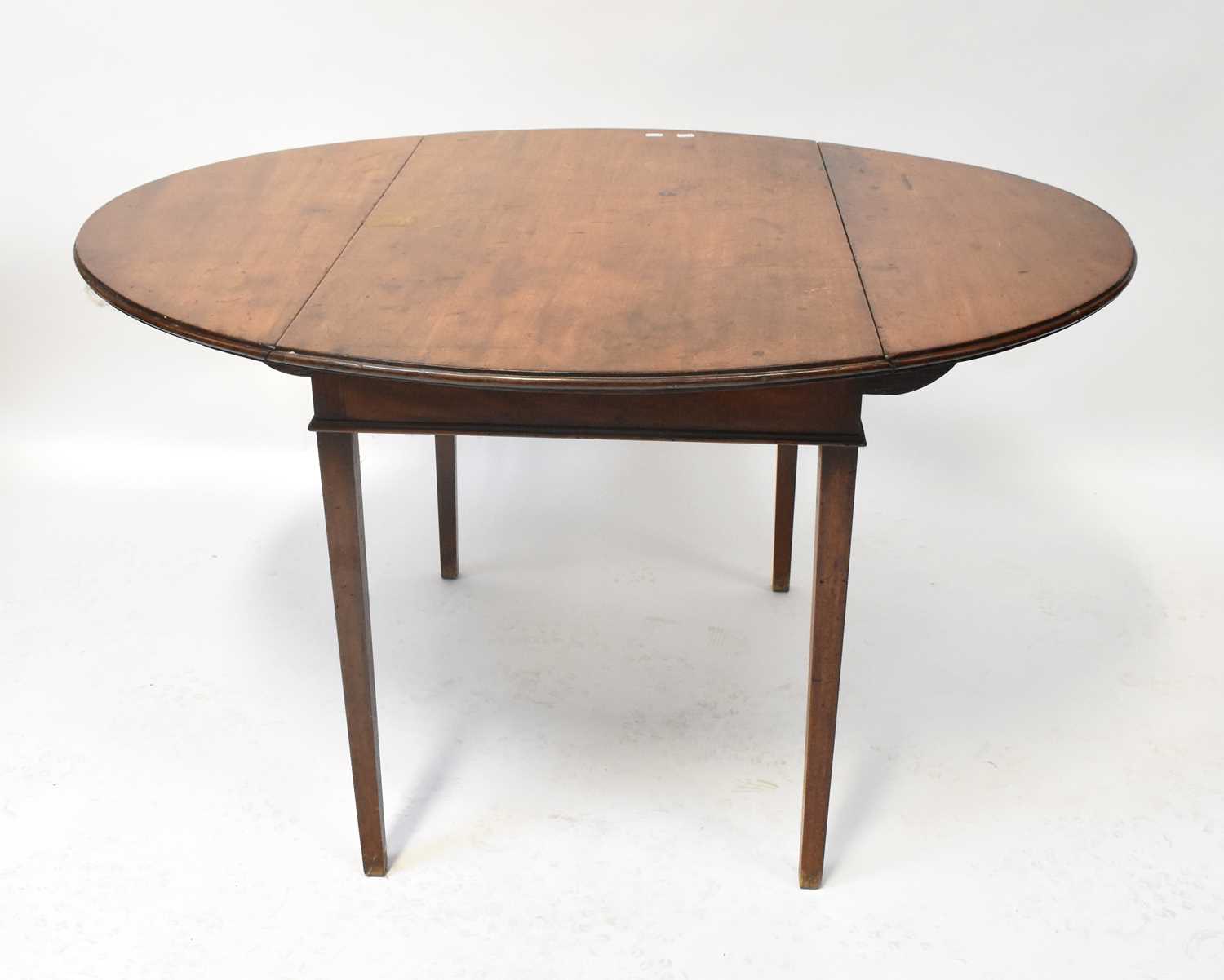 Lot 24 - A George III mahogany drop-leaf supper table...