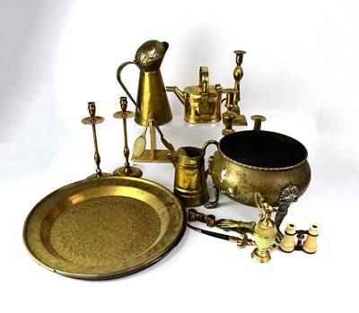 Lot 424 - A quantity of brassware to include fire irons,...