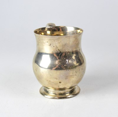 Lot 742 - A George VI silver mug of baluster form, on a...