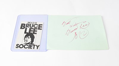 Lot 145 - BRUCE LEE; a torn page from an autograph album...
