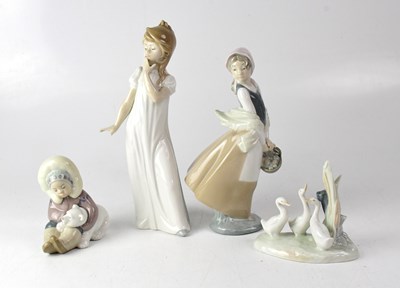 Lot 576 - NAO; three figures comprising a young lady in...