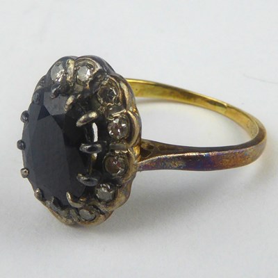 Lot 824 - An 18ct gold sapphire and diamond ring, the...