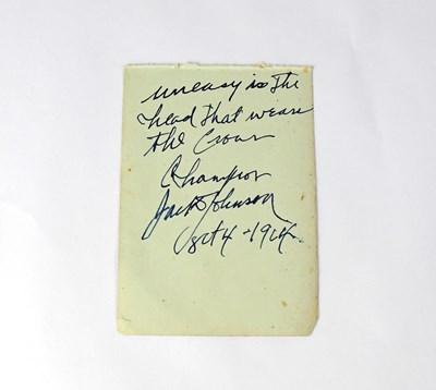 Lot 379 - JACK JOHNSON; a torn page from an autograph...