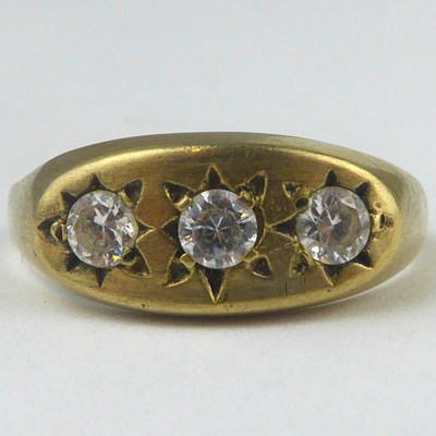 Lot 834 - A 9ct gold ring with three white stones in a...